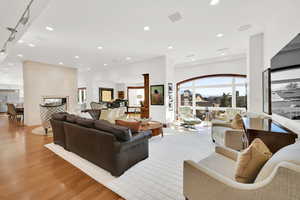 Living room featuring White Oak Wood Flooring with 10-foot ceilings and city views from the large windows