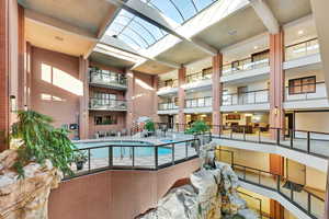 View of the swimming pool in the six-story atrium with a skylight