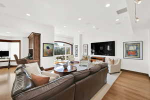 Living room featuring White Oak Wood Flooring with 10-foot ceilings