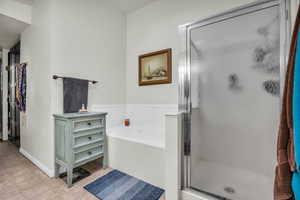 Primary bathroom with soaker tub and separate shower