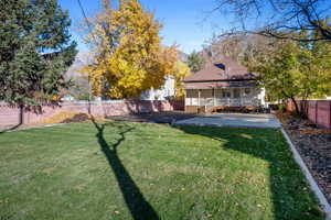 View of yard featuring a mountain view and a porch