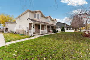 Exterior space with a yard and a porch