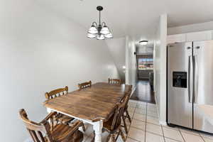 Dining room featuring a chandelier and light hardwood / wood-style flooring