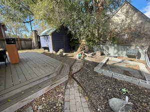 Deck featuring a storage unit