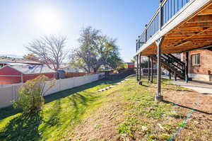 View of yard with a deck