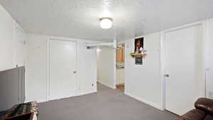 Interior space featuring a textured ceiling and sink