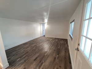 Spare room featuring dark hardwood / wood-style flooring