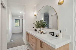 Bathroom featuring ceiling fan and vanity