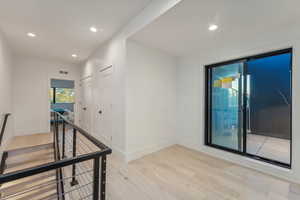 Hallway featuring light hardwood / wood-style floors