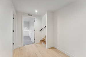 Hallway featuring light hardwood / wood-style floors