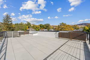 View of patio featuring a mountain view and a balcony