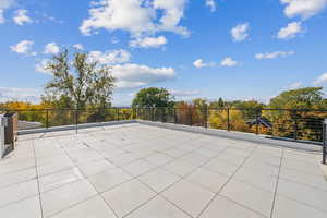 View of patio featuring a balcony