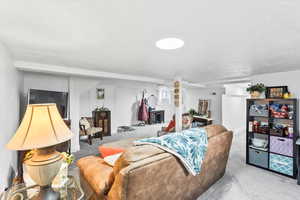 Carpeted living room featuring a textured ceiling