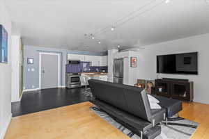 Living room with light hardwood / wood-style floors