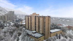 Snowy aerial view featuring a mountain view