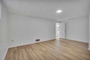 Spare room with light hardwood / wood-style floors