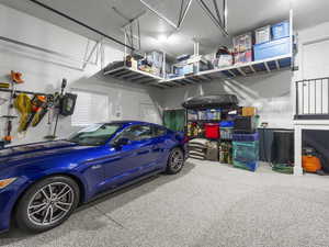 Garage featuring a garage door opener