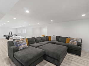 Living room with light hardwood / wood-style floors