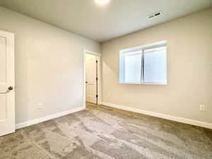 View of carpeted spare room