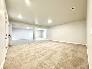 Basement with carpet flooring