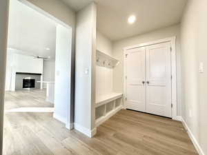 Mudroom featuring light hardwood / wood-style floors and ceiling fan