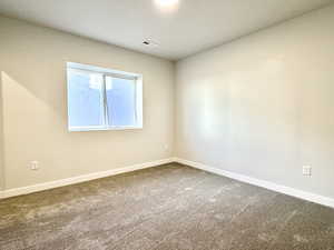 Unfurnished room featuring carpet floors