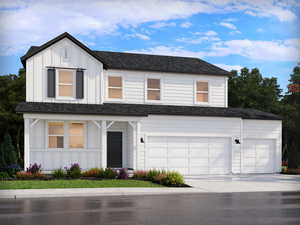 View of front of property featuring a garage