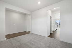 Spare room with dark wood-type flooring and sink