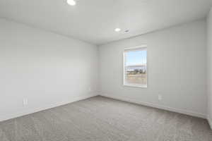 Unfurnished room featuring carpet floors