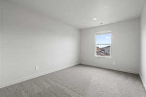 Unfurnished room featuring carpet