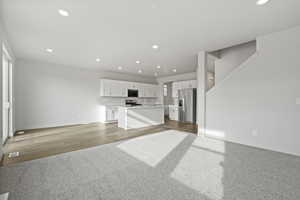 Unfurnished living room featuring hardwood / wood-style flooring