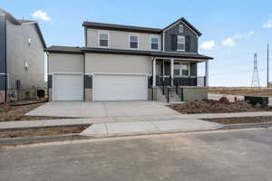 View of front facade featuring a porch, a garage, and central AC