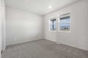 Unfurnished room featuring carpet flooring