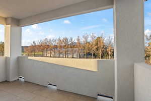 Balcony with baseboard heating and a mountain view