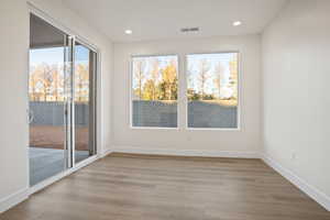 Empty room featuring light wood-type flooring