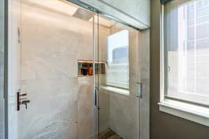 Bathroom with a shower with shower door