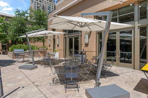 View of patio with a grill, french doors, and exterior kitchen