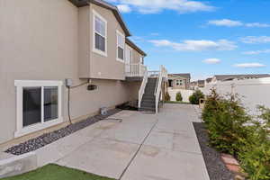 View of property exterior with a patio area