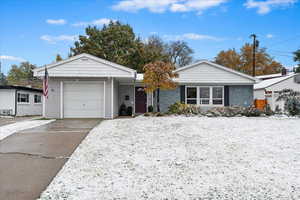 View of front of property featuring a garage