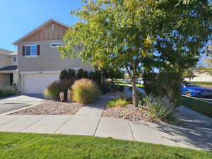 View of property exterior with a garage