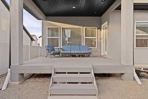 Wooden deck featuring outdoor lounge area