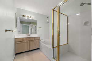 Bathroom with vanity and separate shower and tub