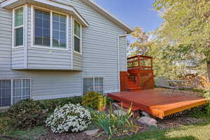 View of home's exterior with a wooden deck