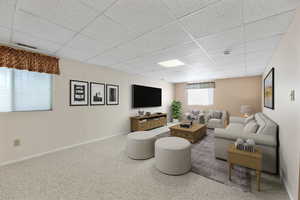 Living room featuring a paneled ceiling