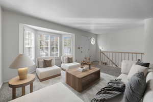 Carpeted living room featuring a textured ceiling