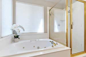 Bathroom featuring separate shower and tub