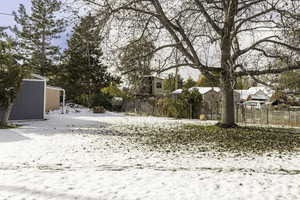 View of yard covered in snow