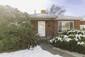 View of snow covered property entrance