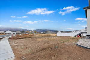 View of yard featuring a mountain view and no backyard neighbors