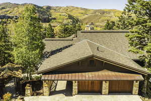 Birds eye view of property with a mountain view